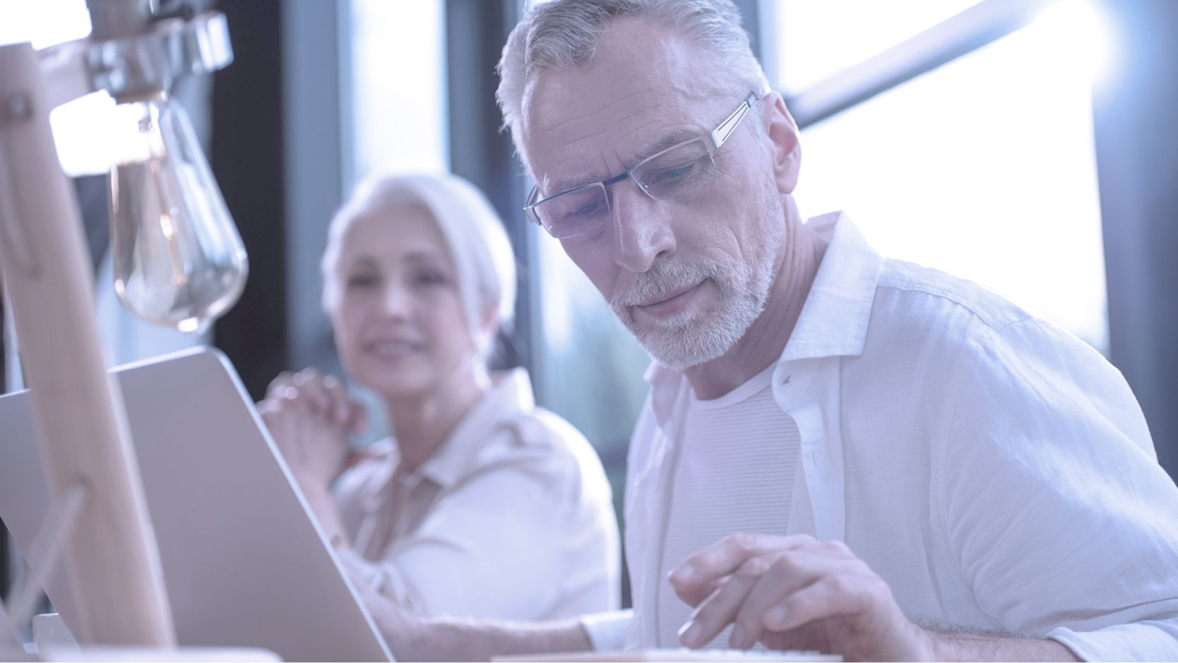 Senior couple using a laptop. 