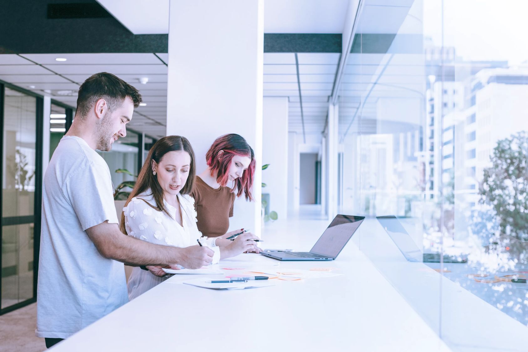 Colleagues working together in a brightly lit office