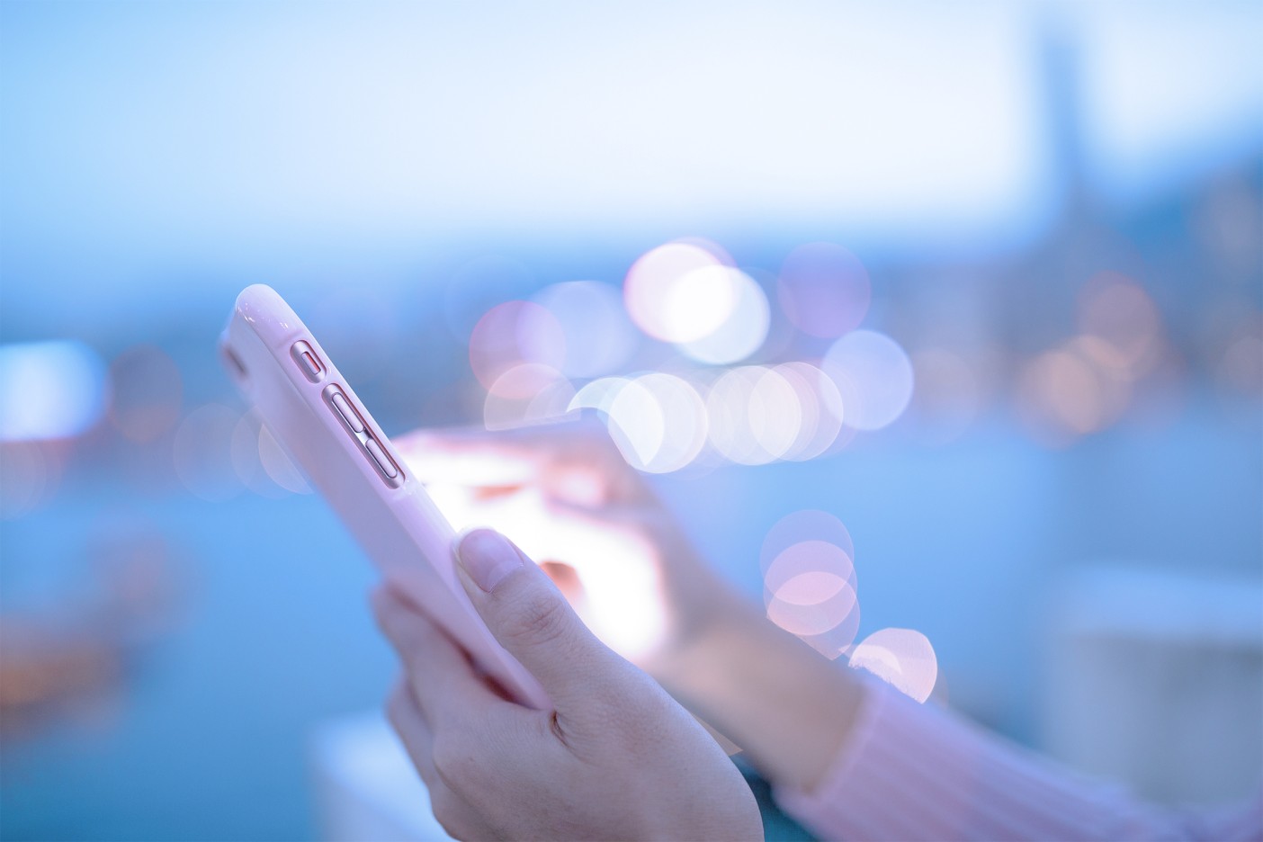 Woman interacting with a tablet outdoors. 