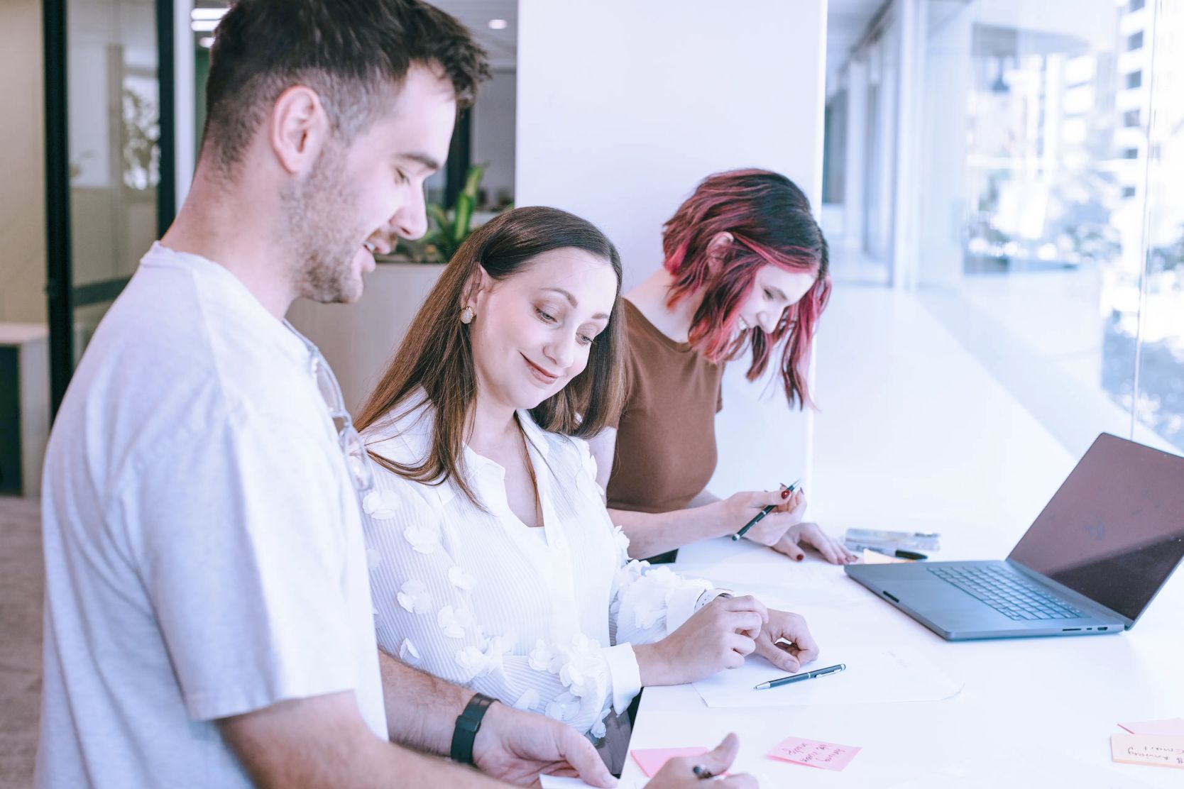 Colleagues working together in a brightly lit office