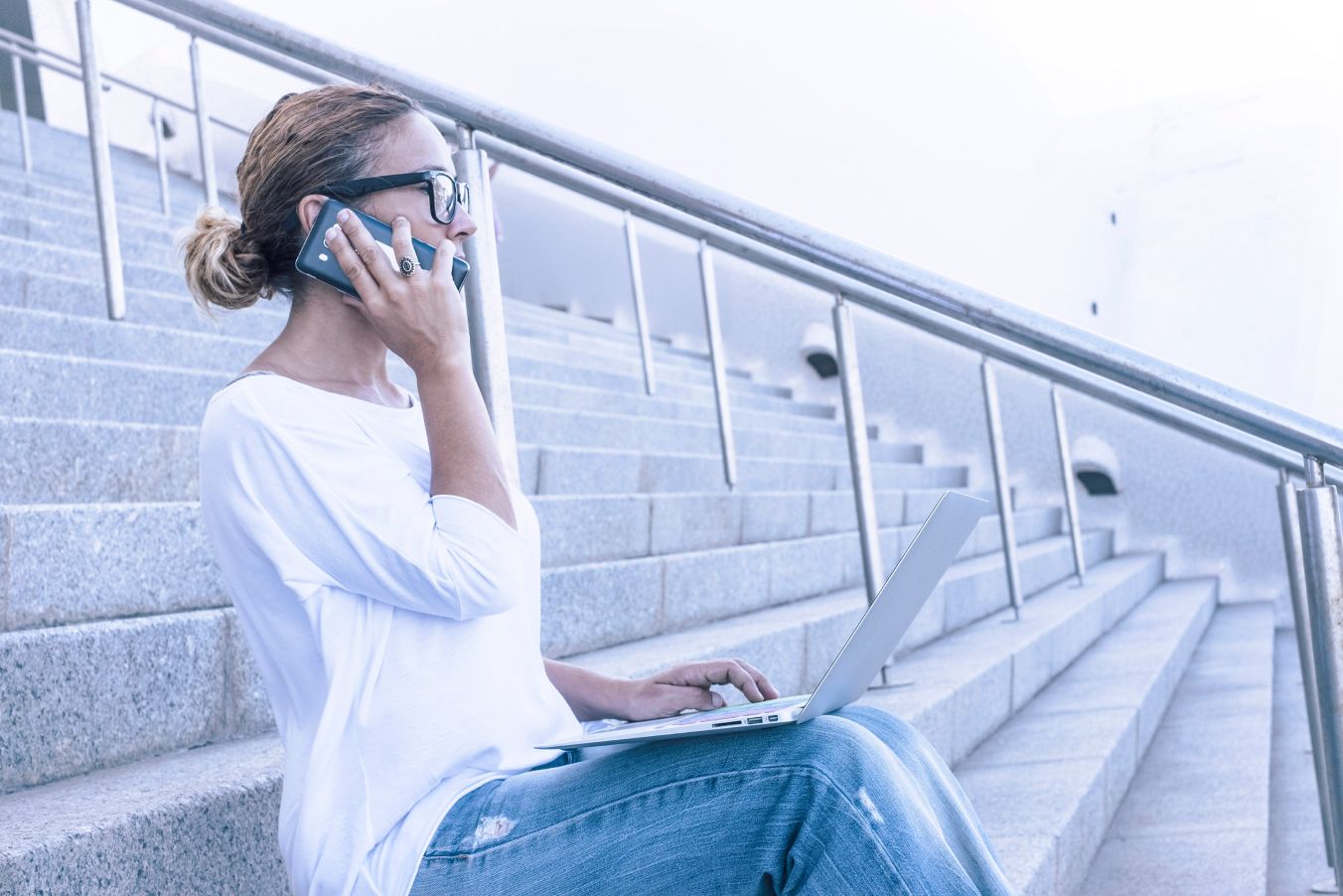 Woman taking a mobile phone call outdoors.