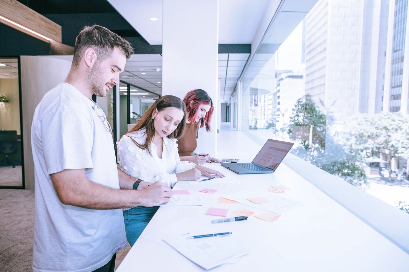 Colleagues working together in a brightly lit office