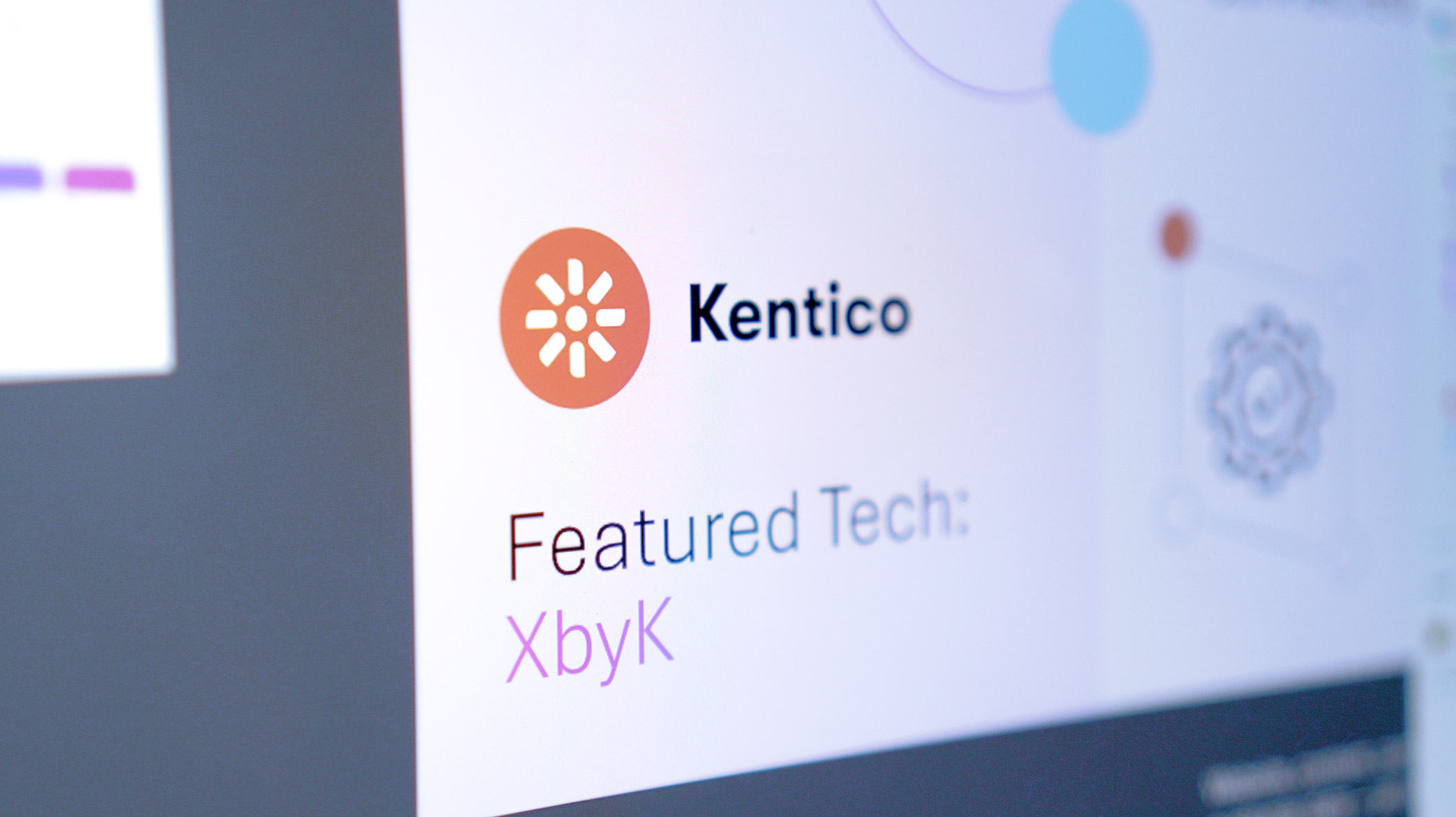 Close up of Kentico Logo on a computer screen.