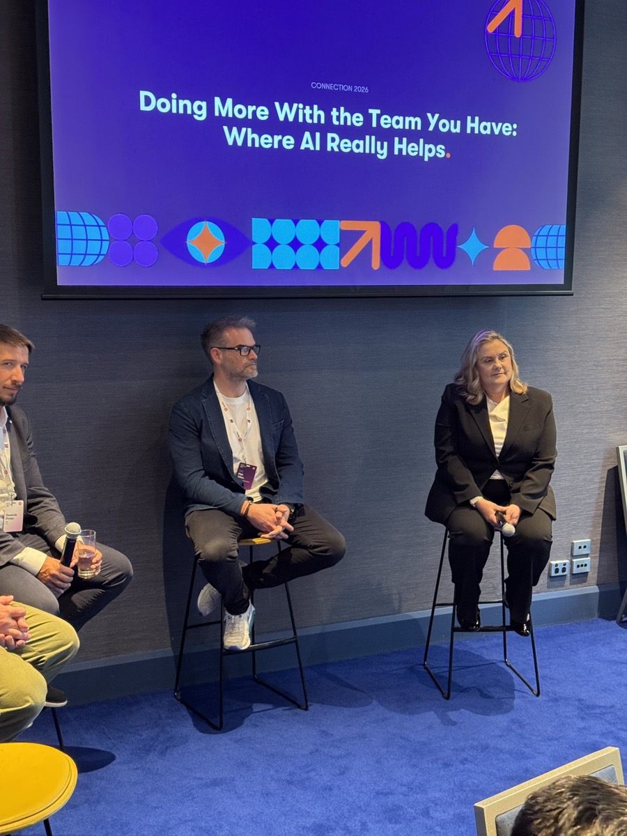 The panel 'Doing More With the Team You Have: Where AI Really Helps' on stage at Kentico Connection 2026