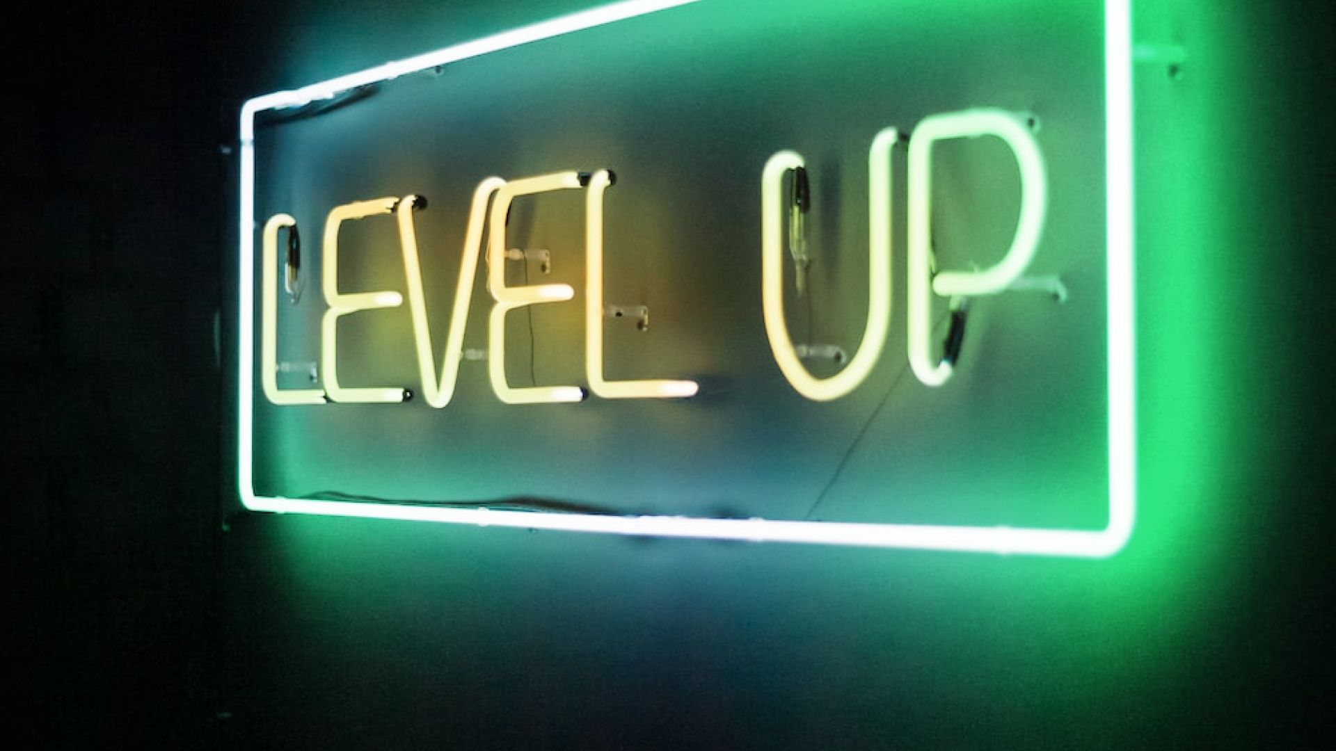 Neon sign with words 'Level Up' on it
