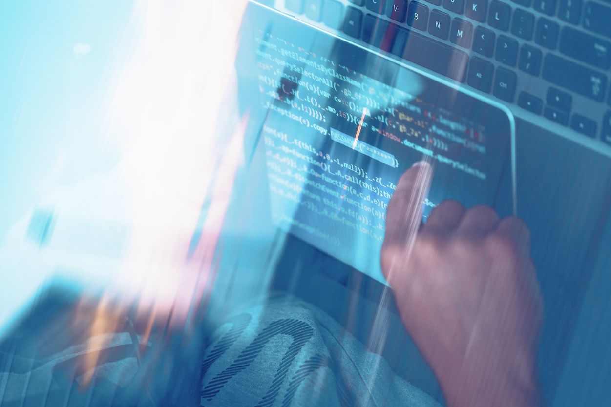 Developer's hand interacting with a tablet topdown view.