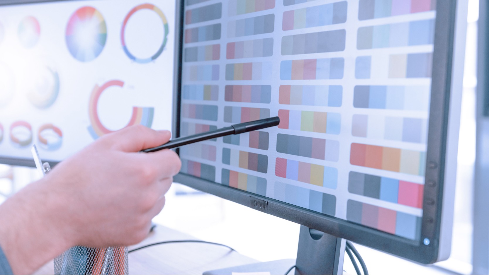 Team collaboration meeting with design materials and sketches on table