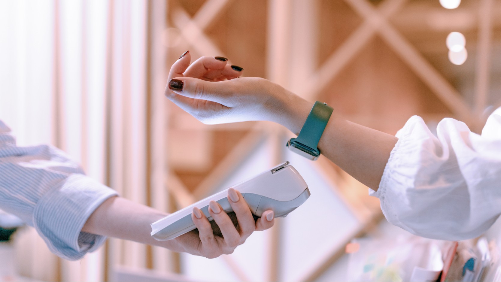 customer making a transaction using her smartwatch 