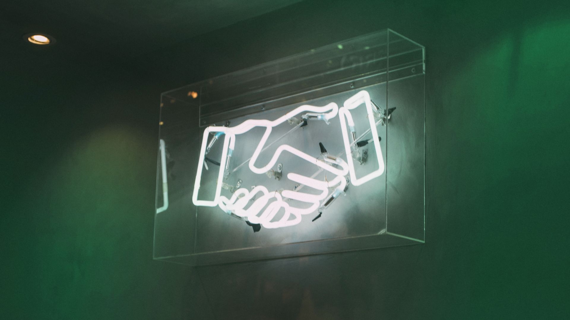 Image of handshake neon sign