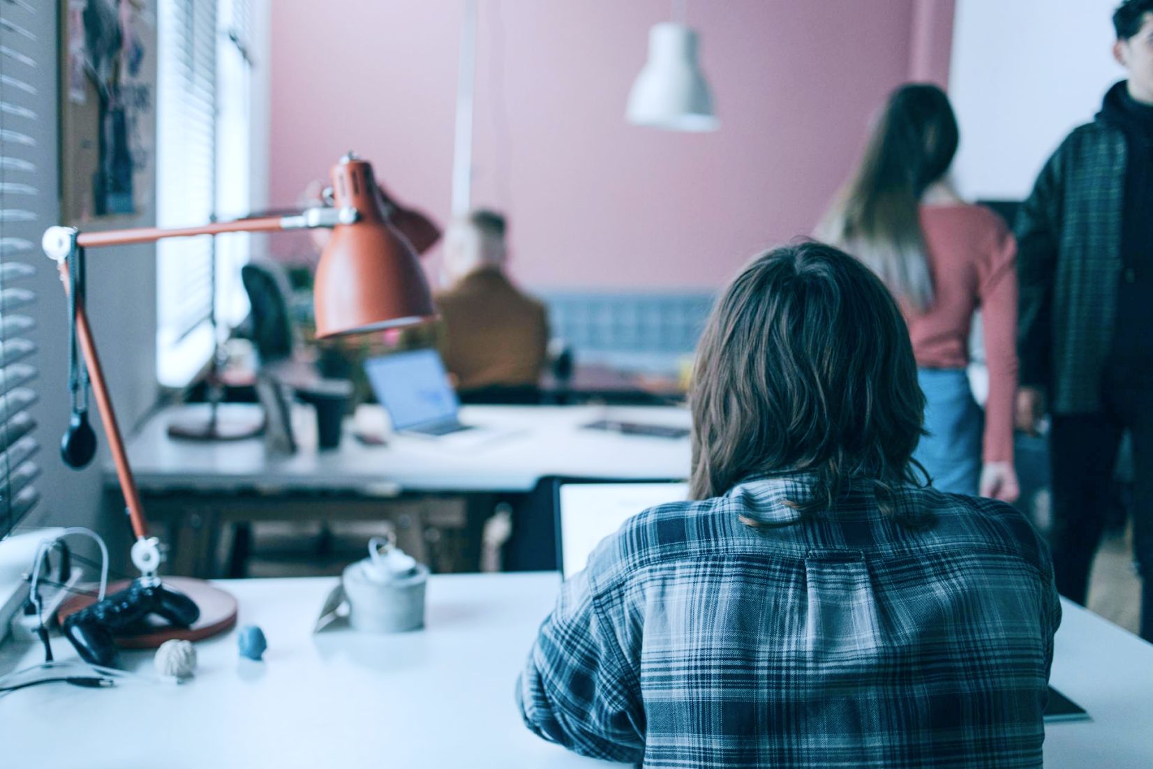 back view of colleague working in an office