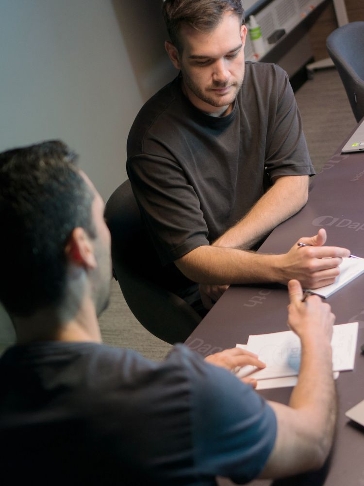 Two men discussing work matters in meeting