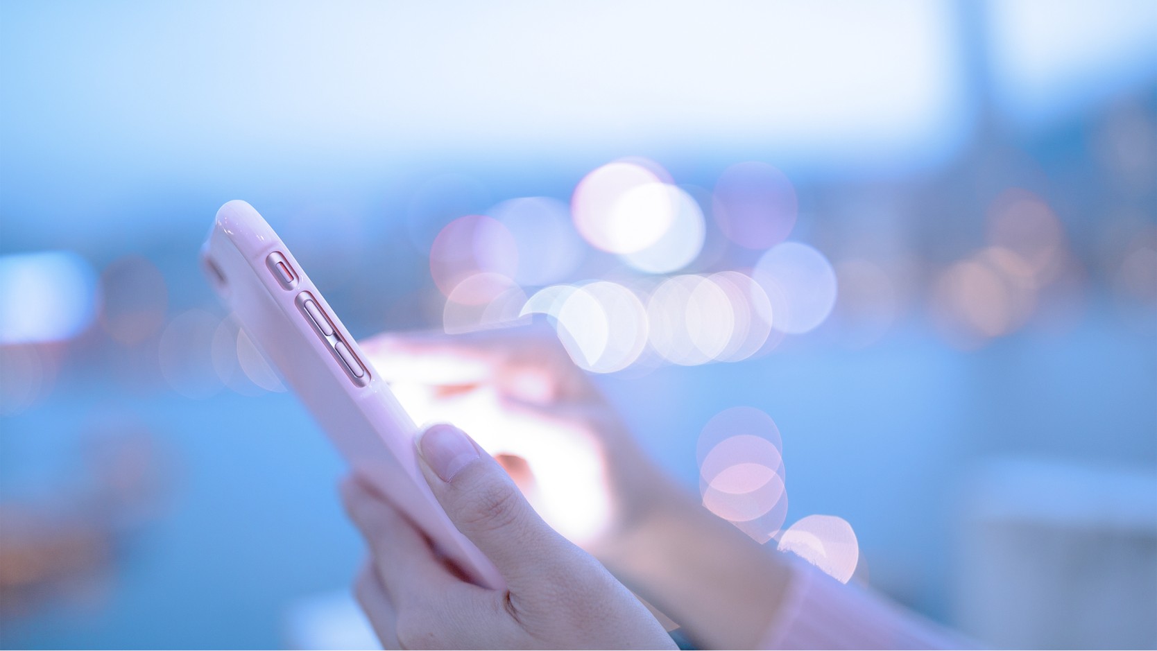 person interacting with tablet outdoors