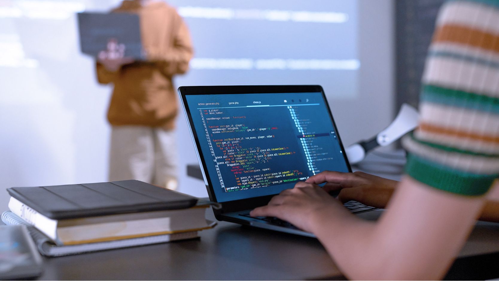 Student learning programming with a laptop. 