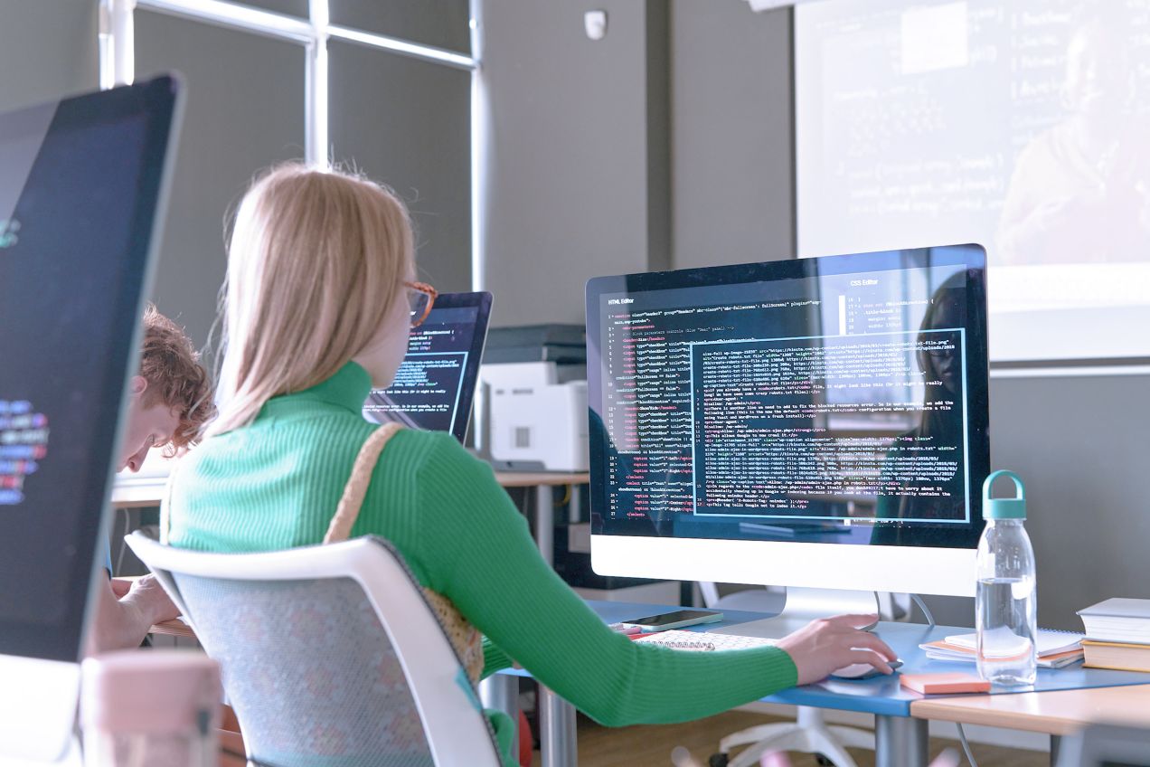 Student learning programming in a classroom. 