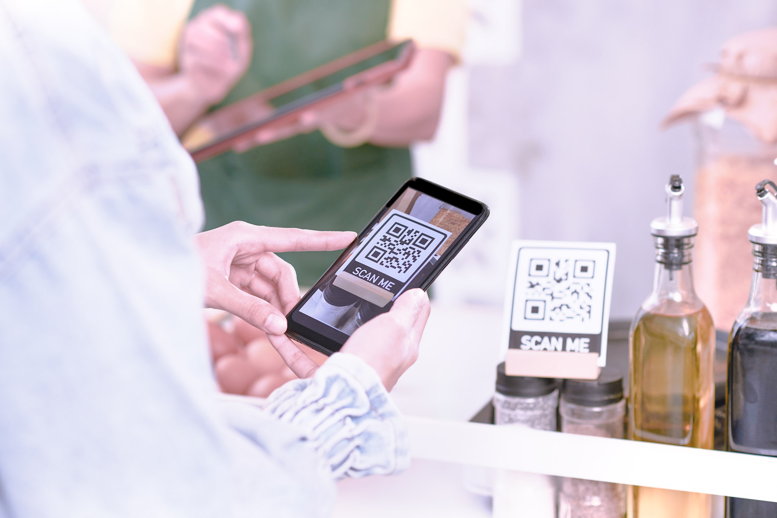 customer making a transaction by scanning a QR code