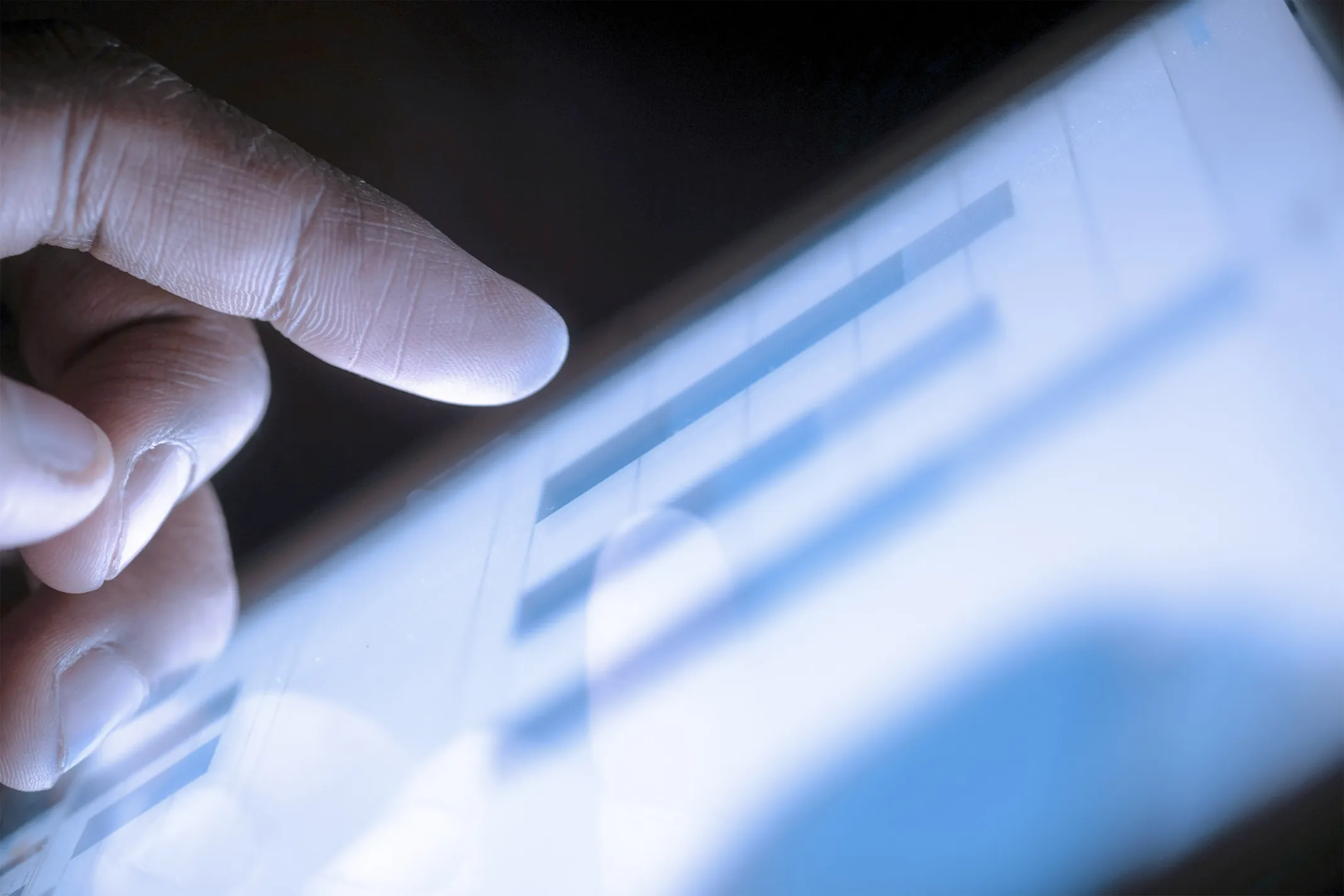 Close up of hands interacting a tablet