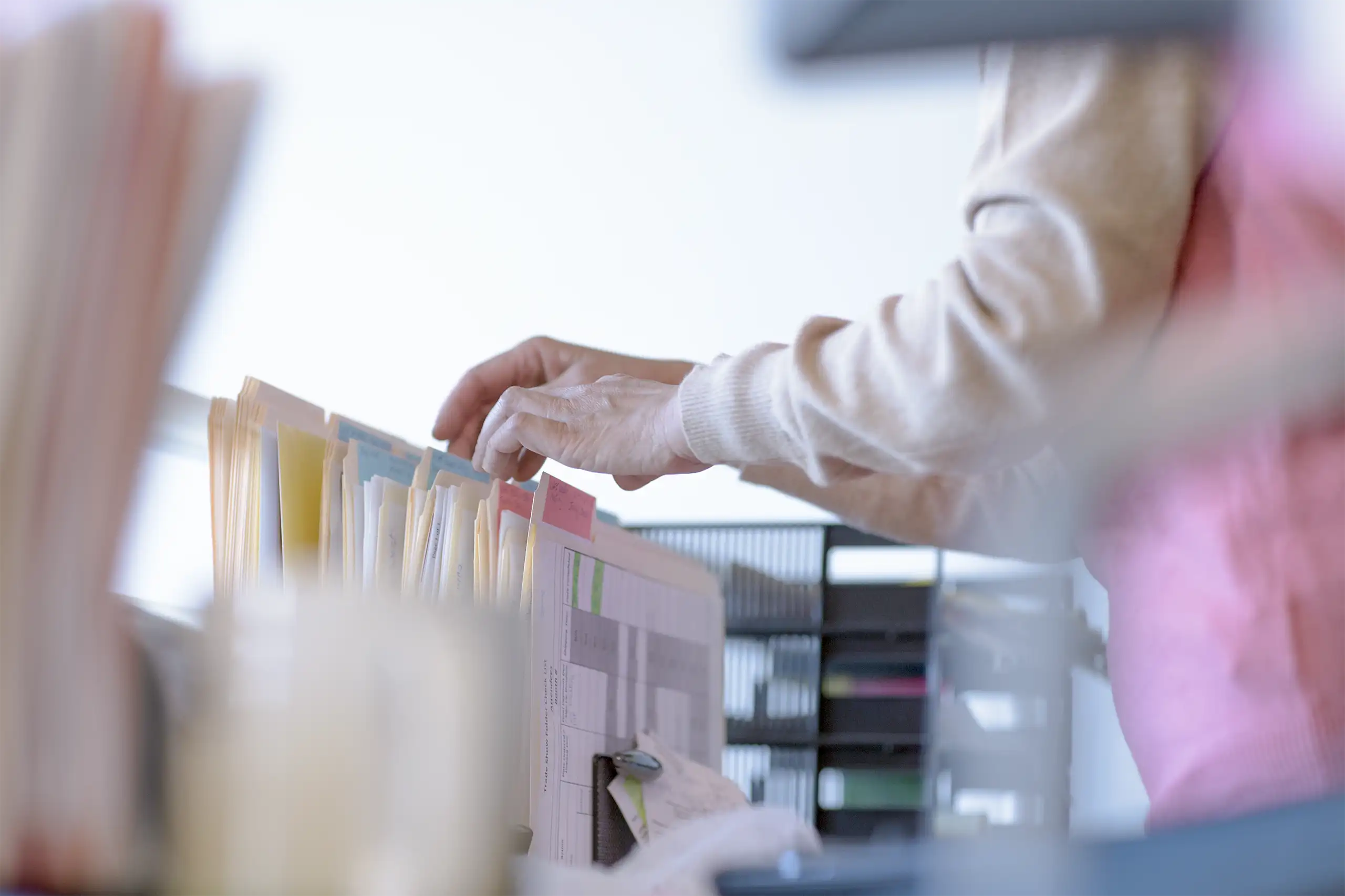 Colleague sifting files and folders. 