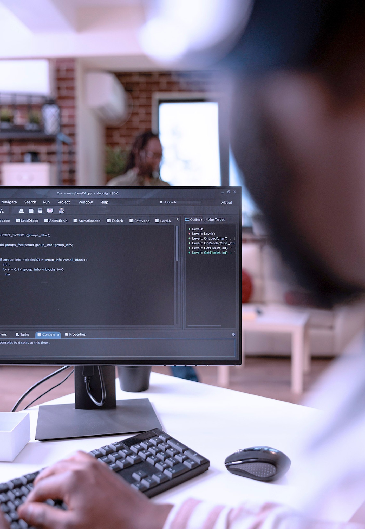 Website developer looking at code in the background. 