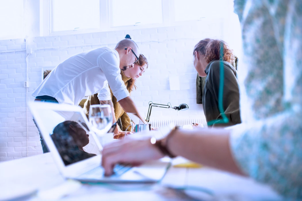 Colleagues working together in a brightly lit office