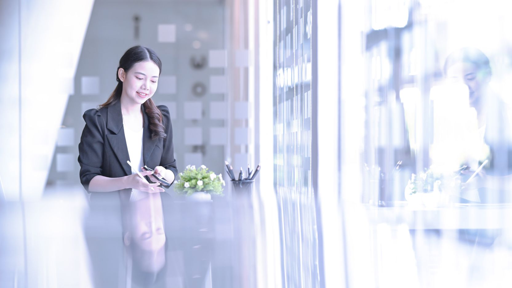 Businesswoman working in a brightly-lit office