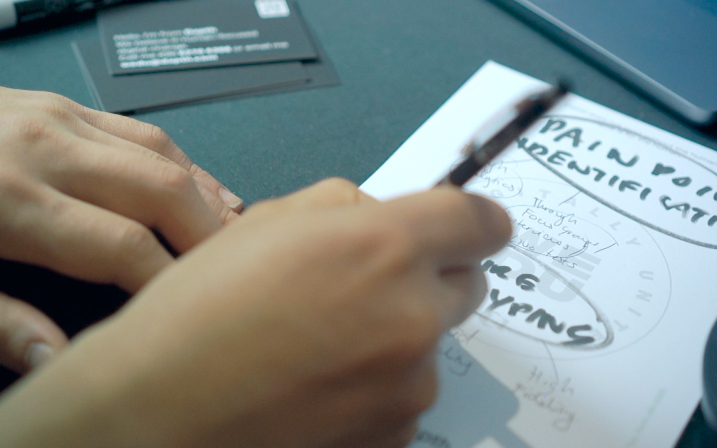 Close up shot of person handwriting on a notepad