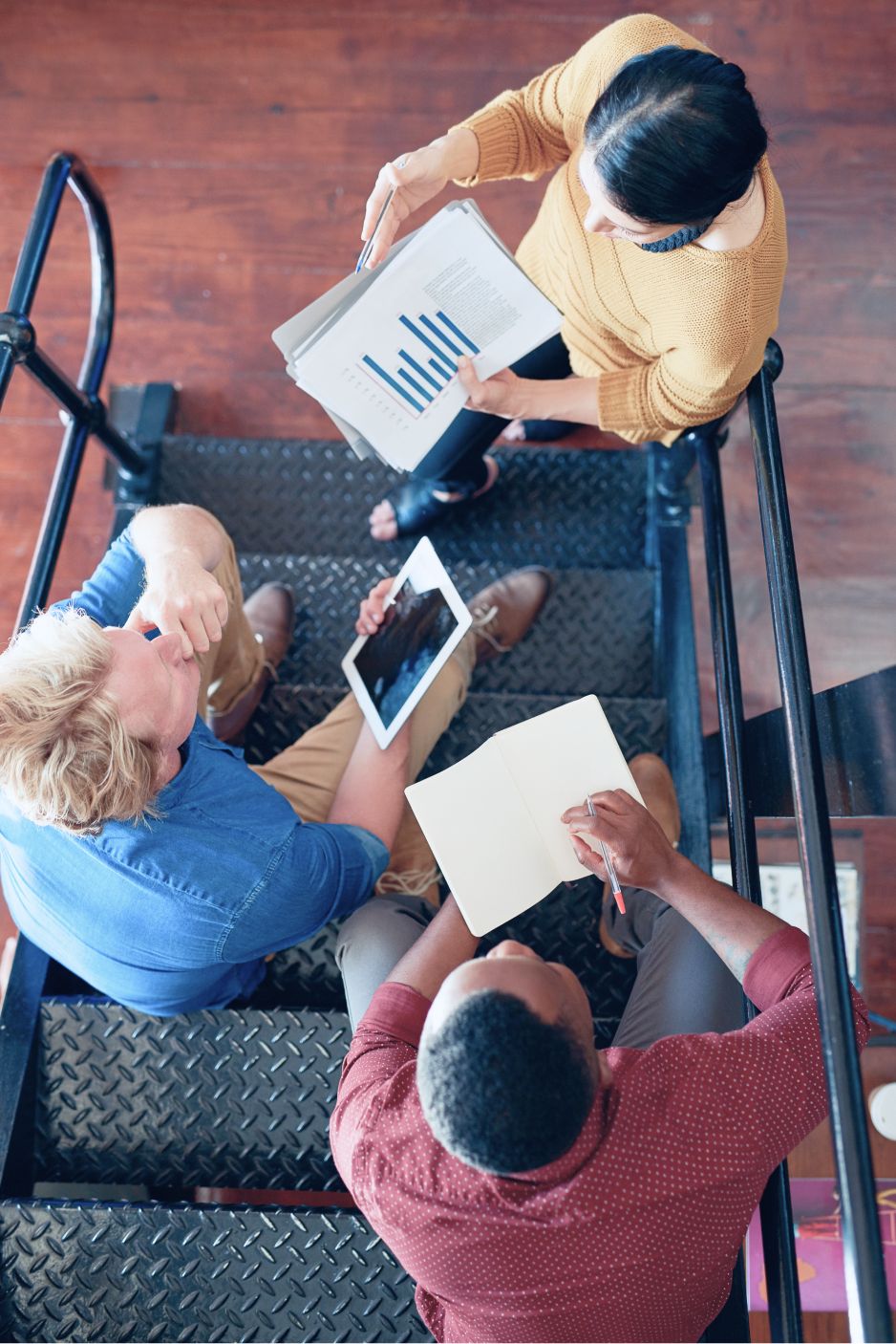 Top down view of workers in collaboration. 