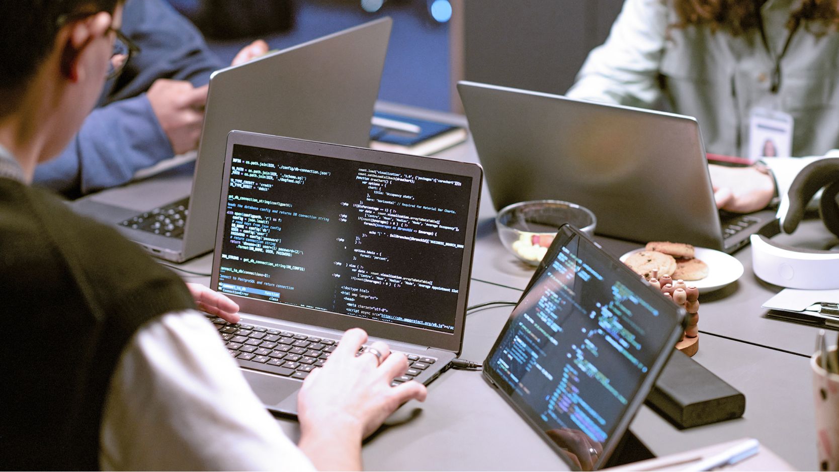 Team of developers collaborating in a room. 