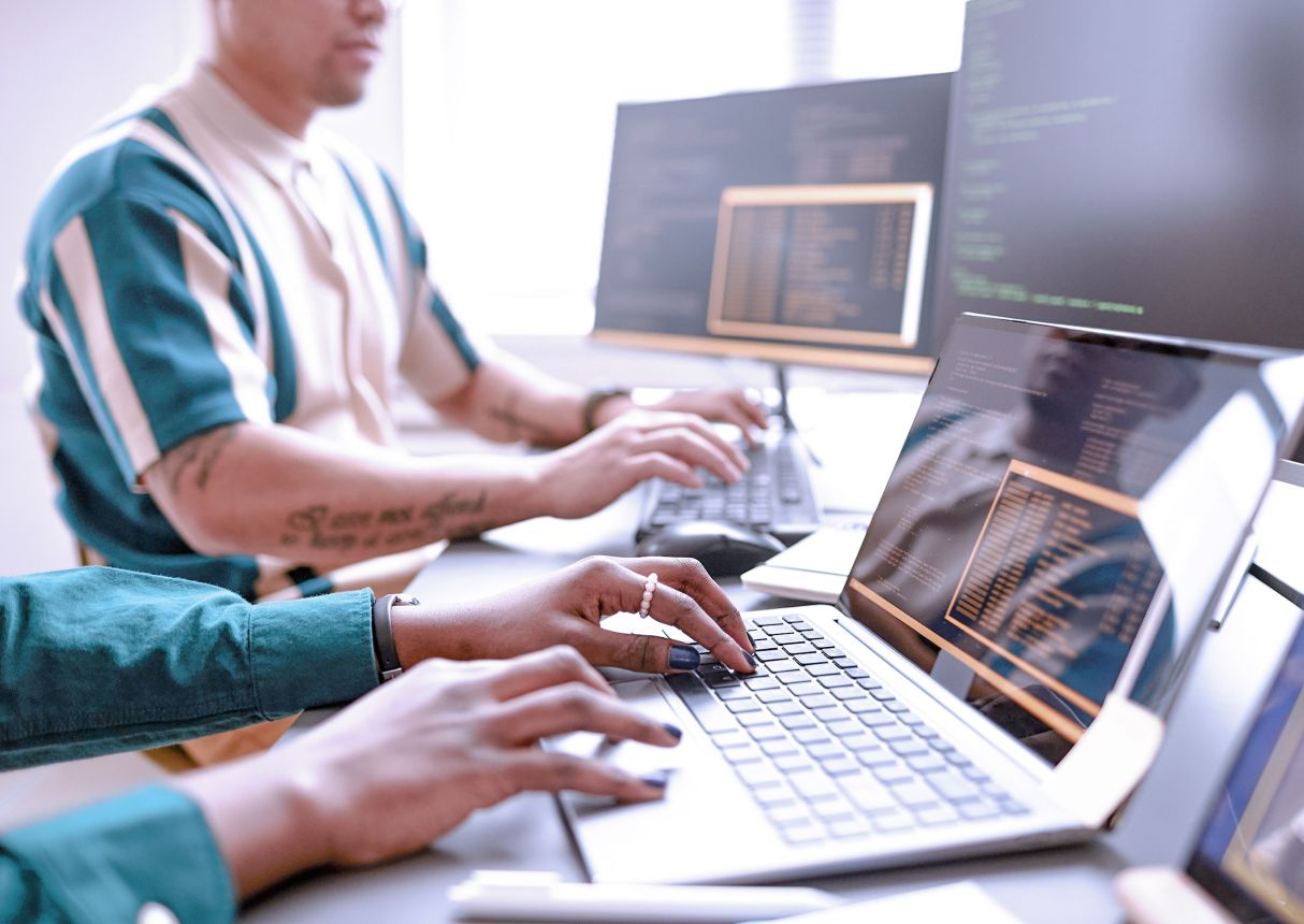 students learning website development in an office