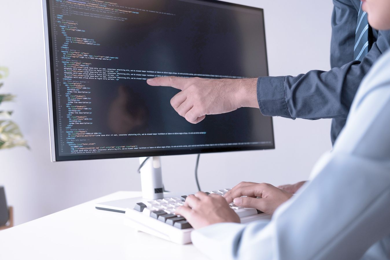 Two developers problem solving together 