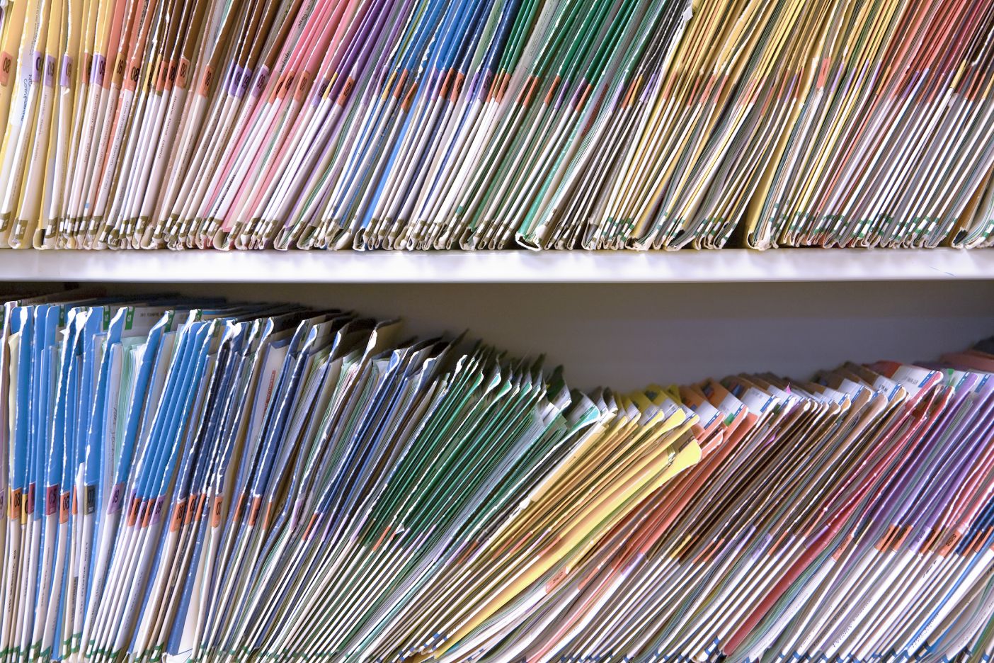 Rows of files and folders on a cabinet
