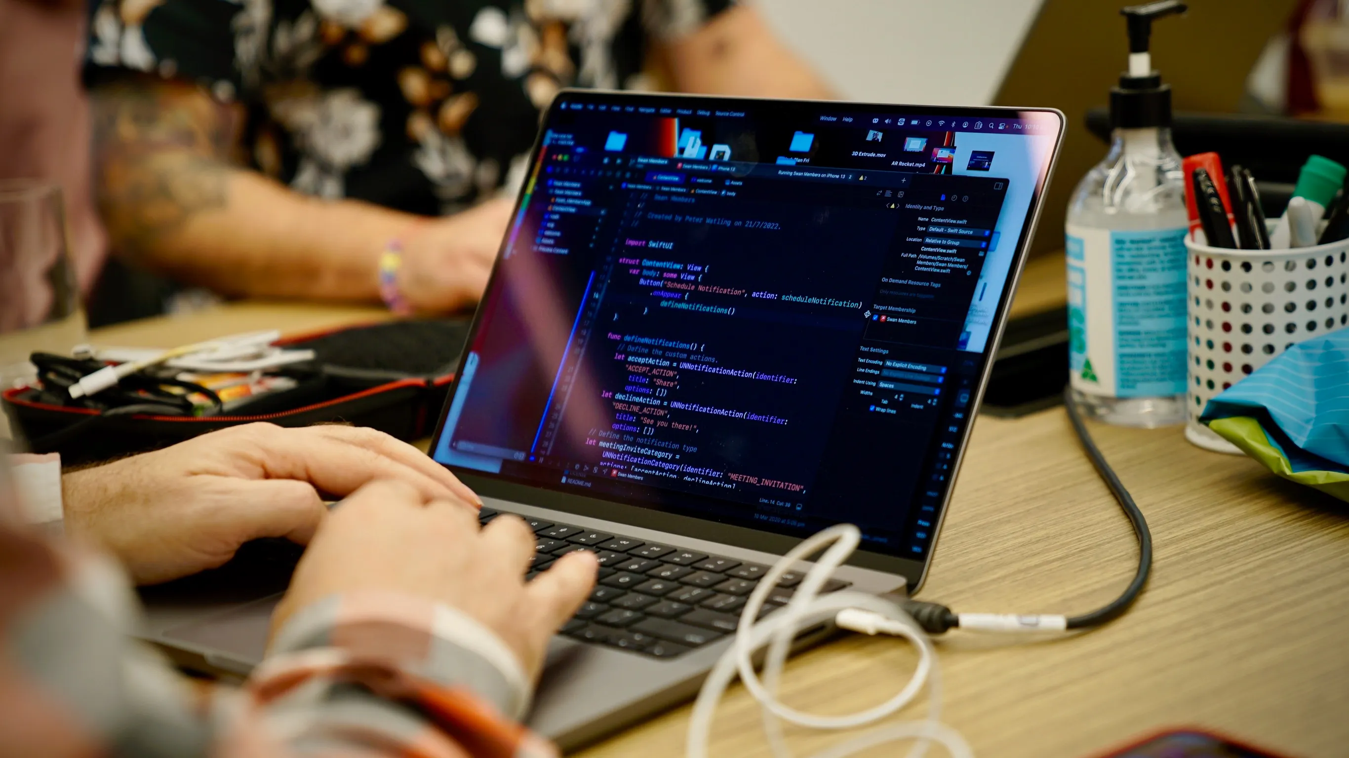 Dapth team member writing code on a laptop