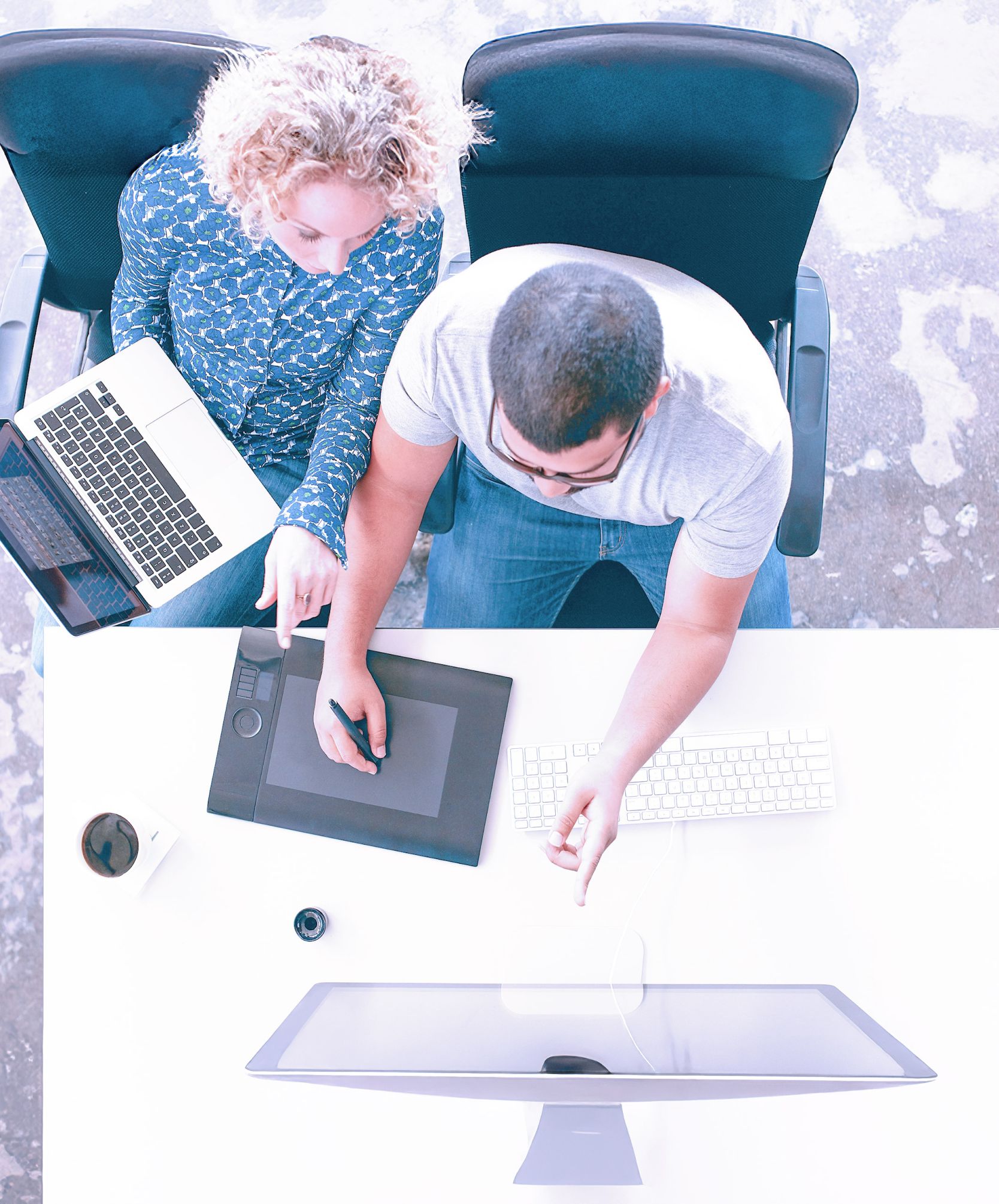 Top down view of colleagues working together. 