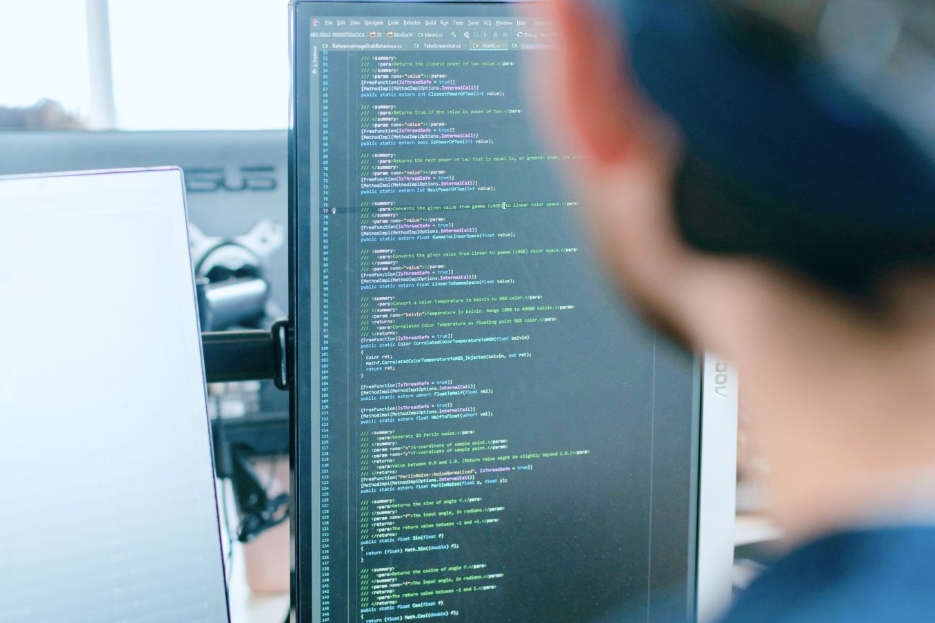 Student taking notes on a sticky notepad