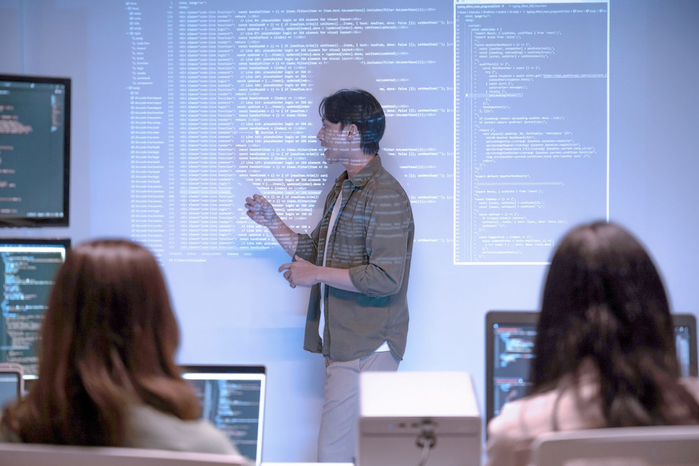 Lead developer giving lecture in office on website development