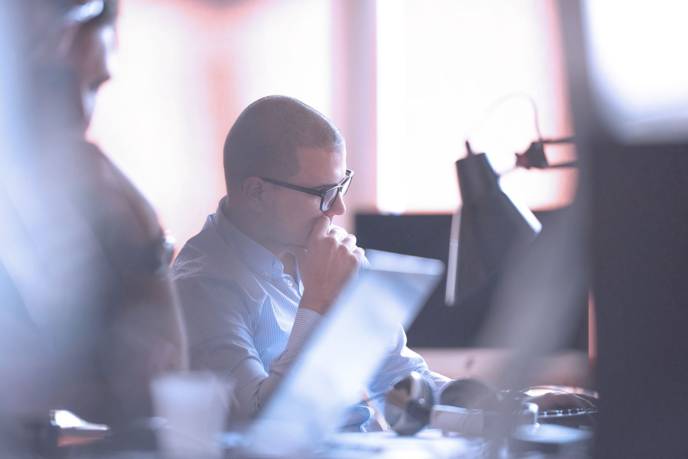 Student taking notes on a sticky notepad