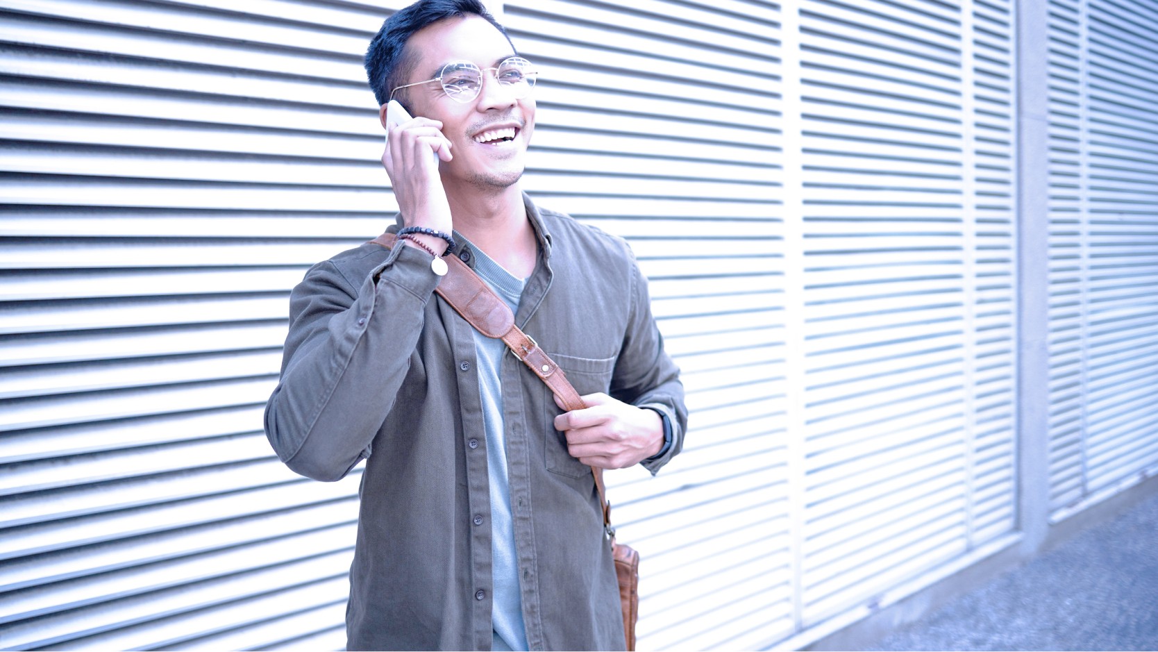 Image of man with a smartphone outdoors